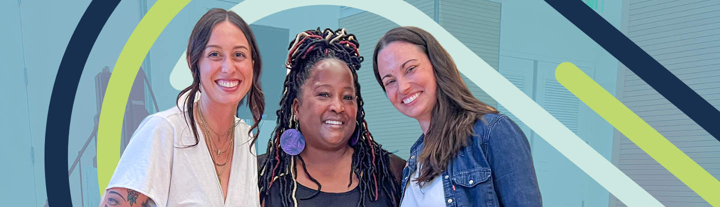 Three women pose for a photo.